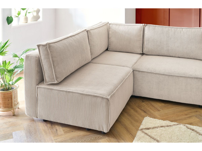 Canapé Nihad beige vue de côté montrant la profondeur et la structure.