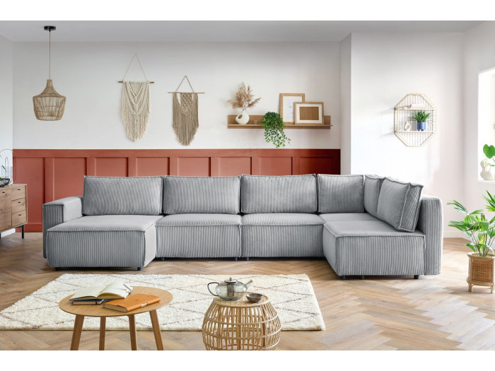 Canapé Nihad gris modulable avec méridienne dans un salon scandinave contemporain.
