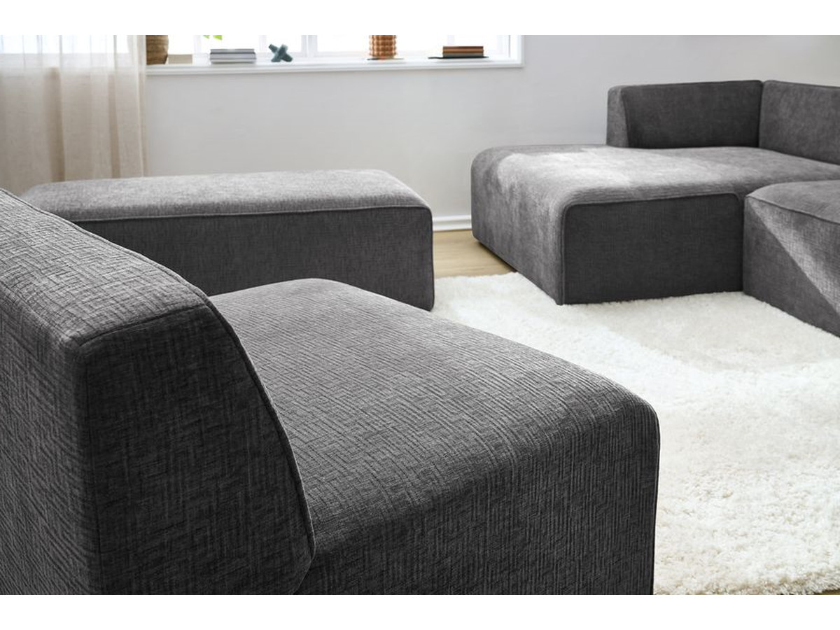 MEGEVE vaste modulaire hoekbank in structuurstof met 1 fauteuil en 1 poef