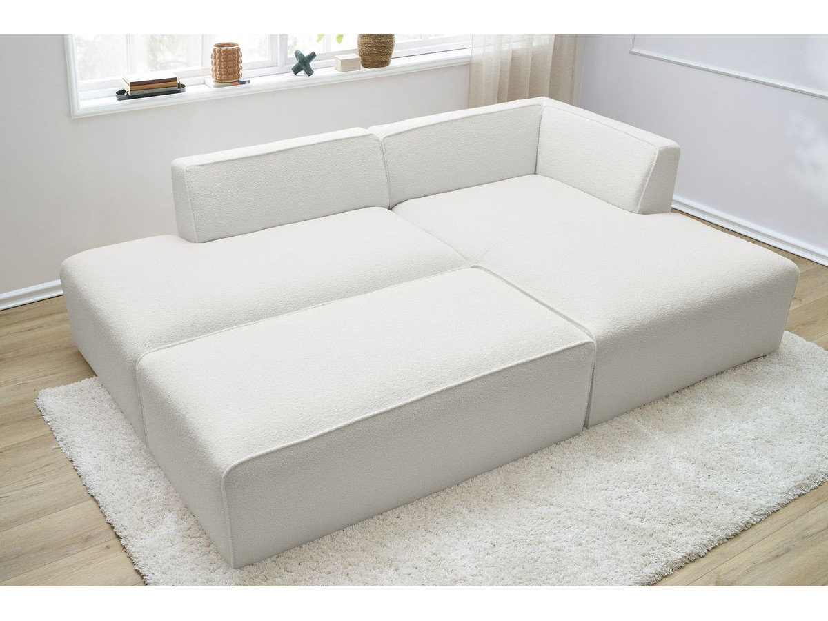 Canapé d'angle fixe modulable MEGEVE tissu bouclette avec pouf