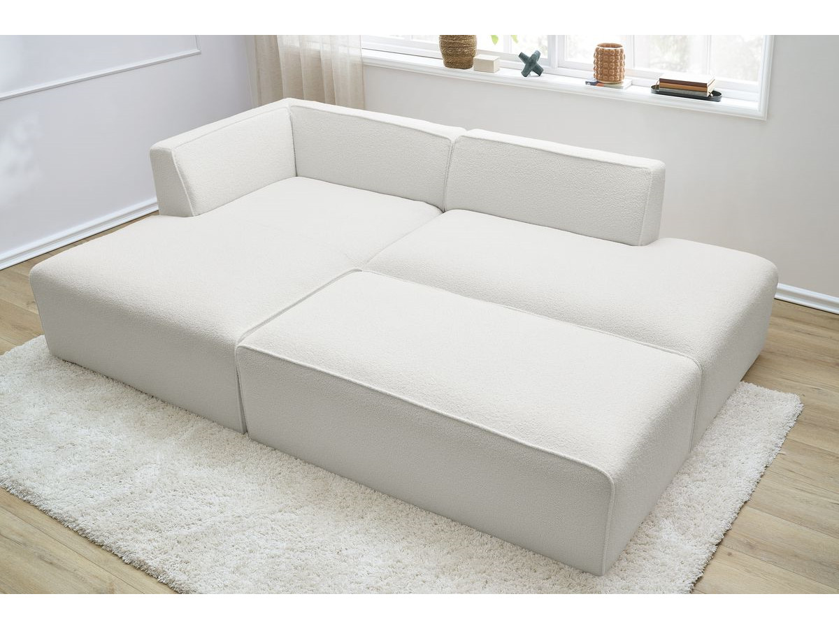 Canapé d'angle fixe modulable MEGEVE tissu bouclette avec pouf