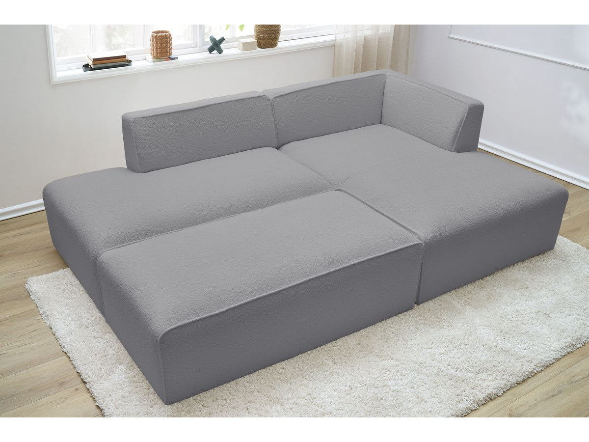 Canapé d'angle fixe modulable MEGEVE tissu bouclette avec pouf