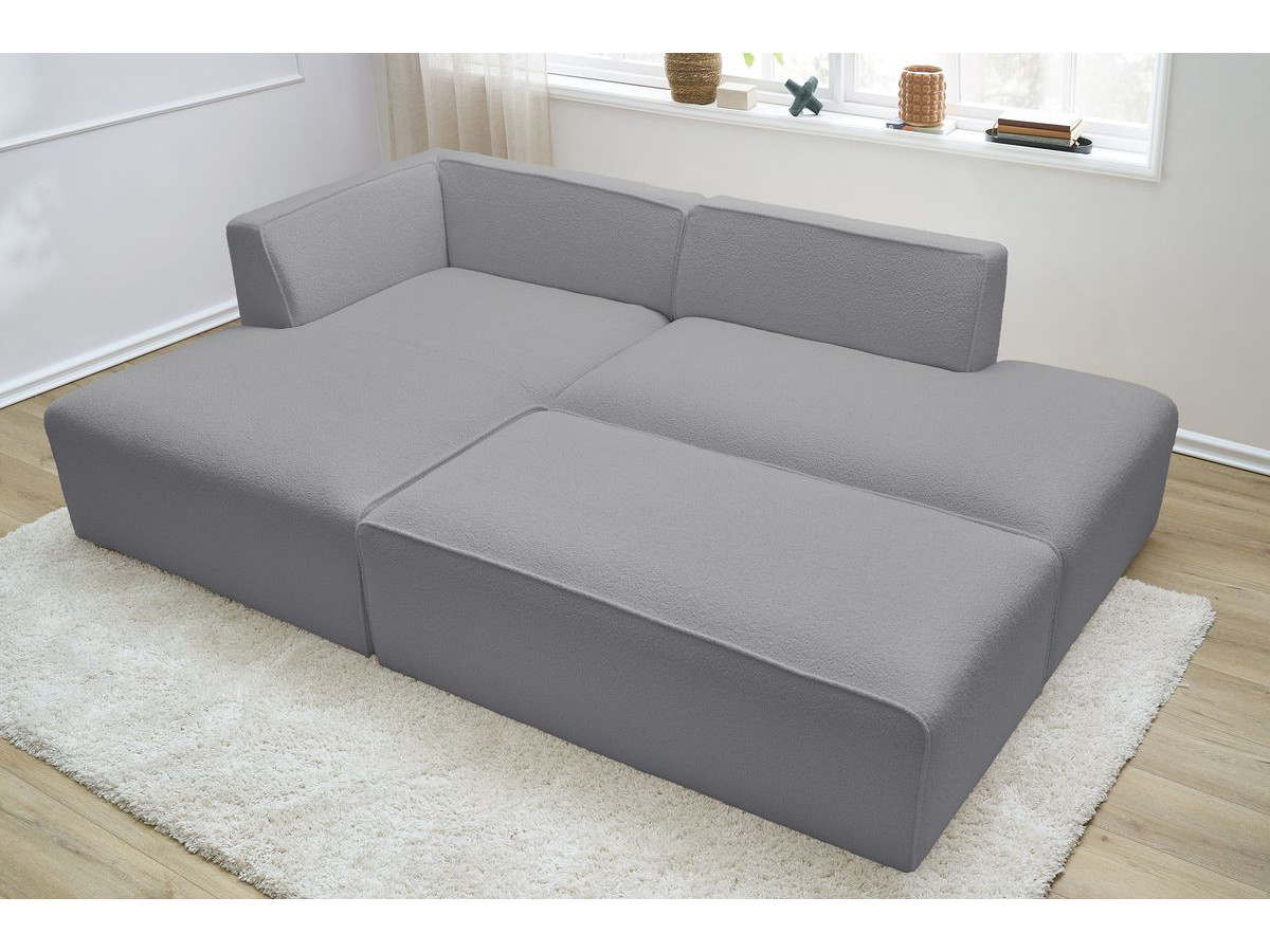 Canapé d'angle fixe modulable MEGEVE tissu bouclette avec pouf