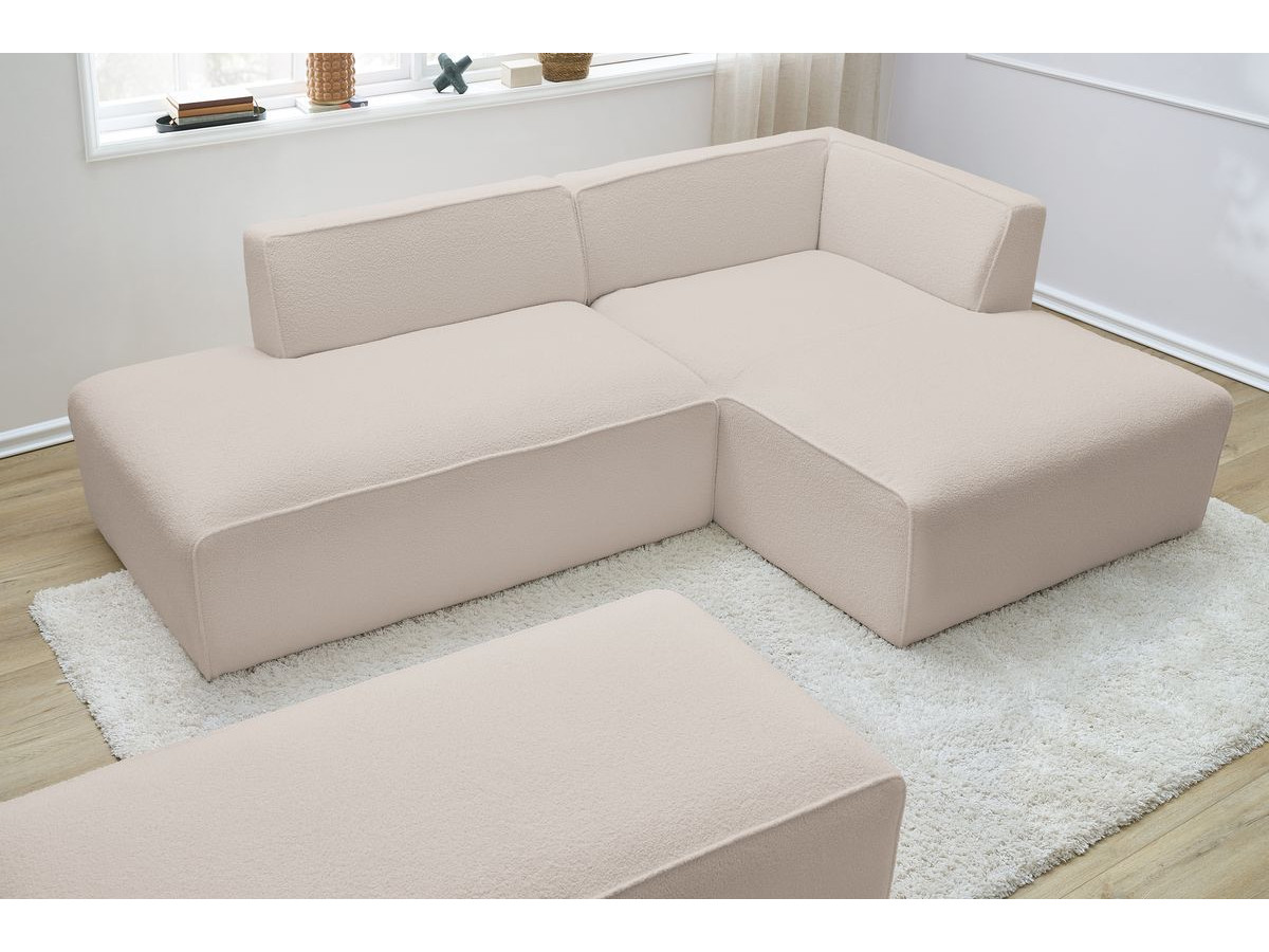 Canapé d'angle fixe modulable MEGEVE tissu bouclette avec pouf