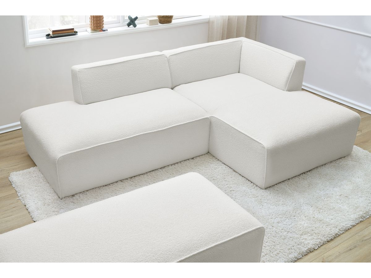 Canapé d'angle fixe modulable MEGEVE tissu bouclette avec pouf