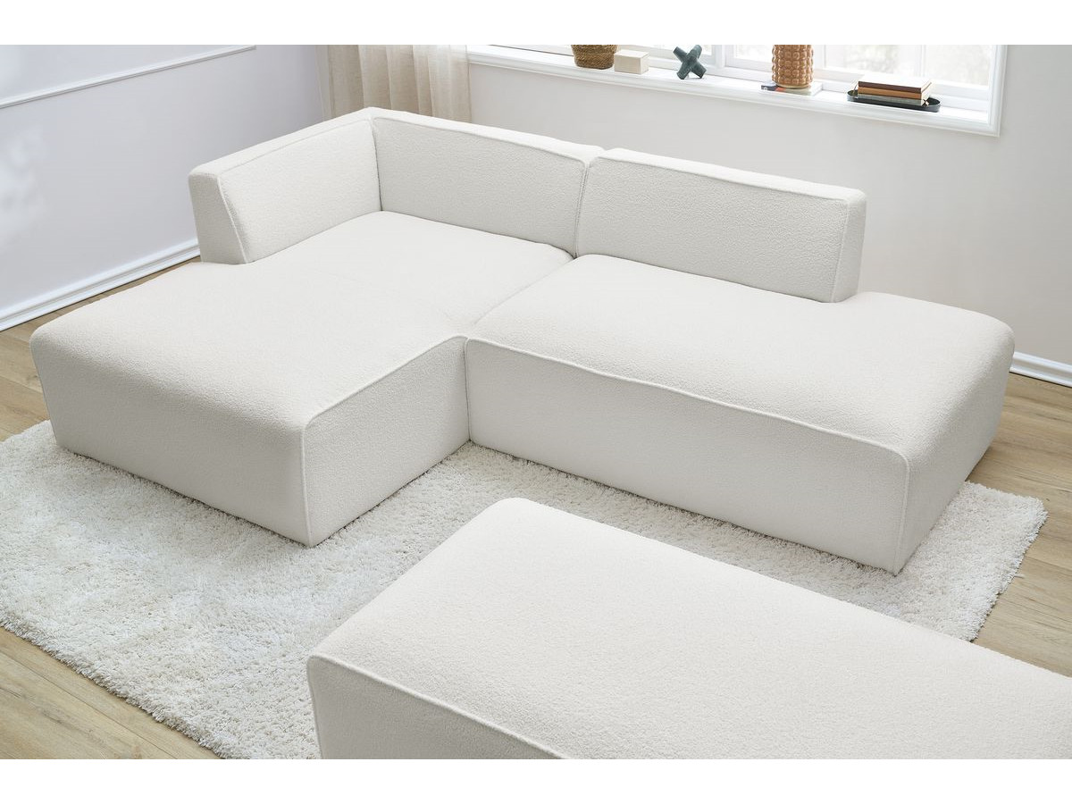 Canapé d'angle fixe modulable MEGEVE tissu bouclette avec pouf
