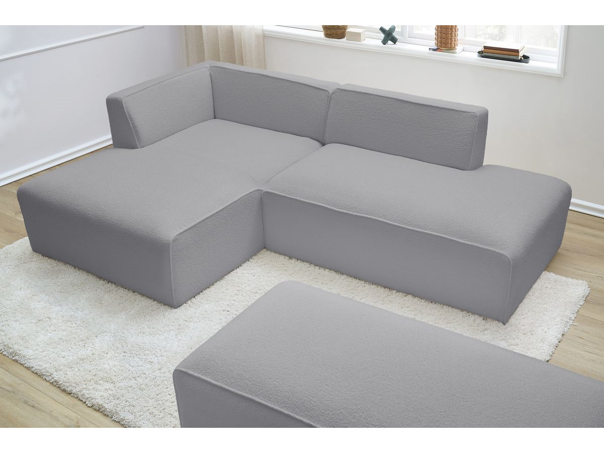 Canapé d'angle fixe modulable MEGEVE tissu bouclette avec pouf