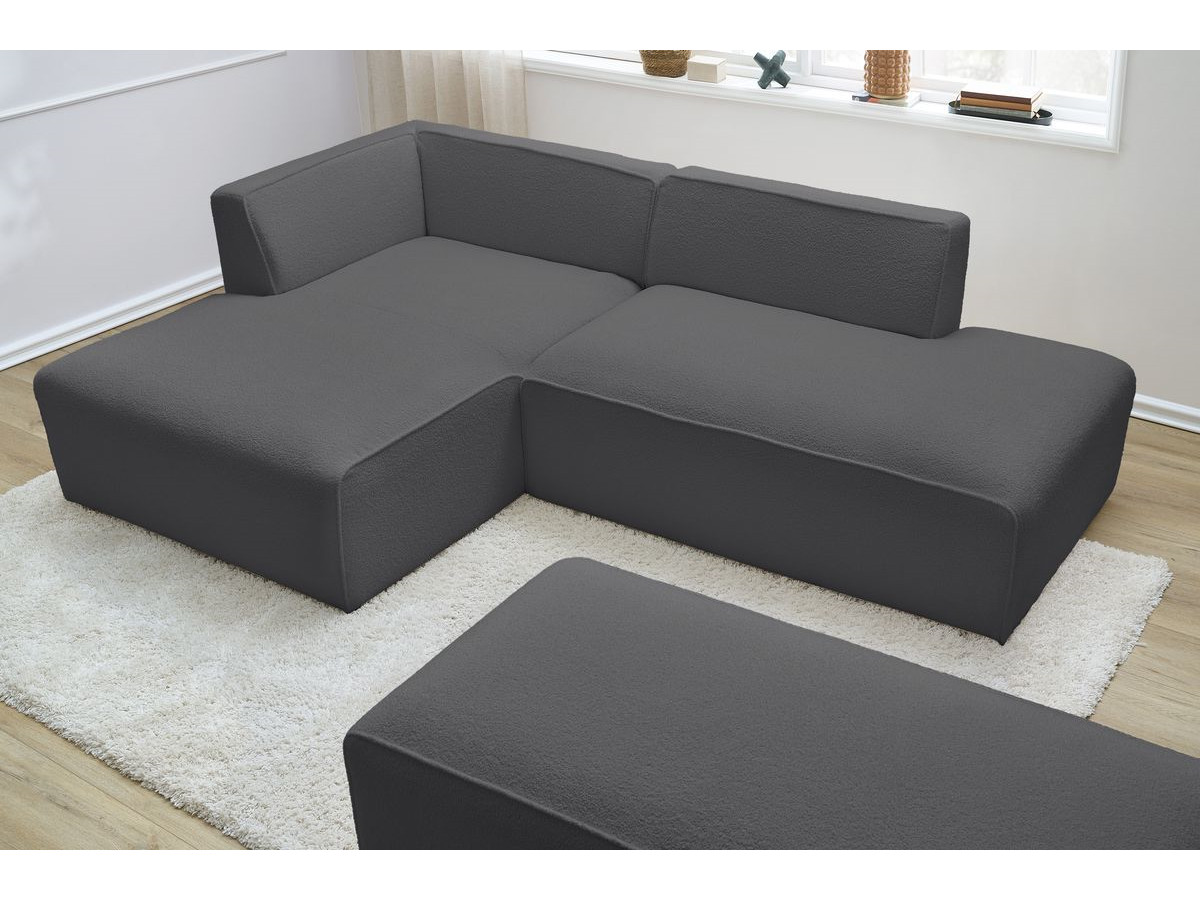 Canapé d'angle fixe modulable MEGEVE tissu bouclette avec pouf