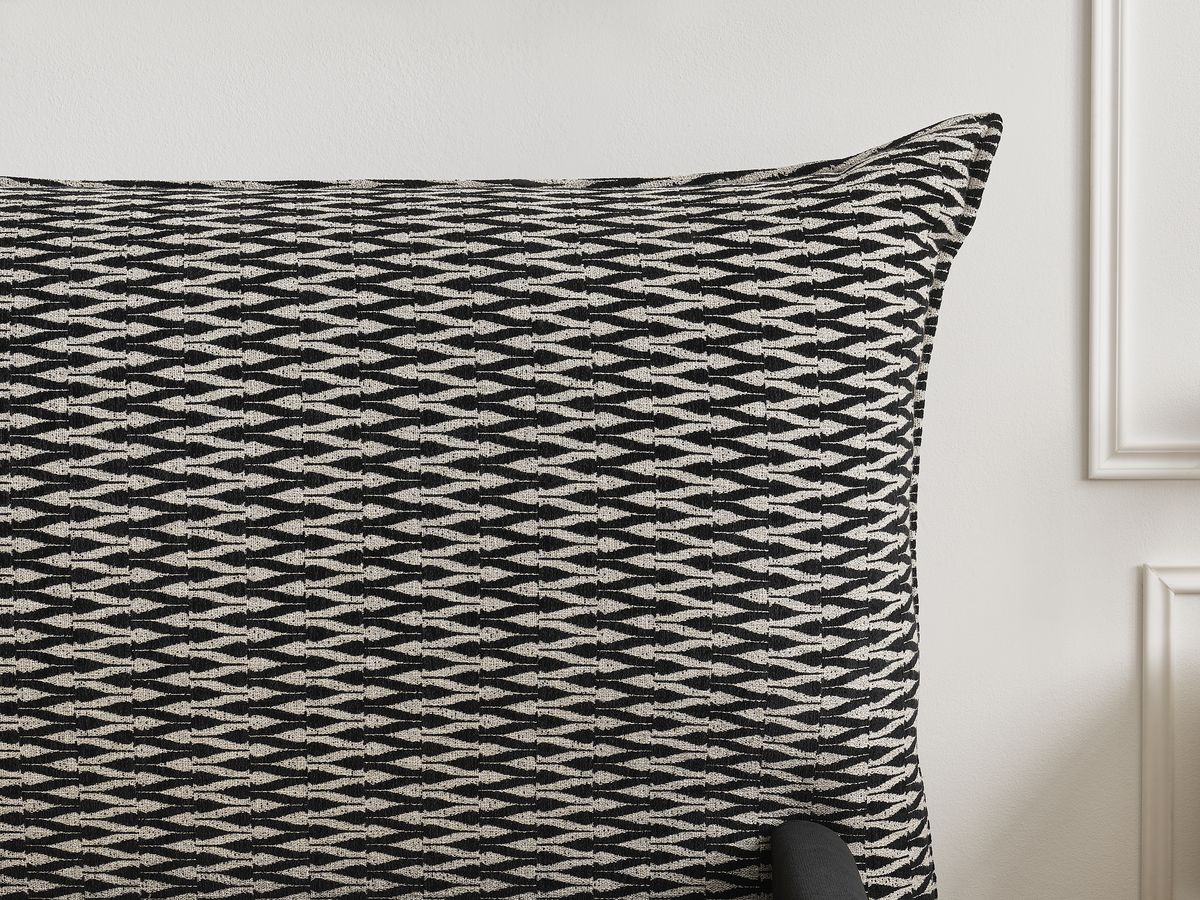Lit coffre JADE avec tête de lit effet oreiller tissu chenille