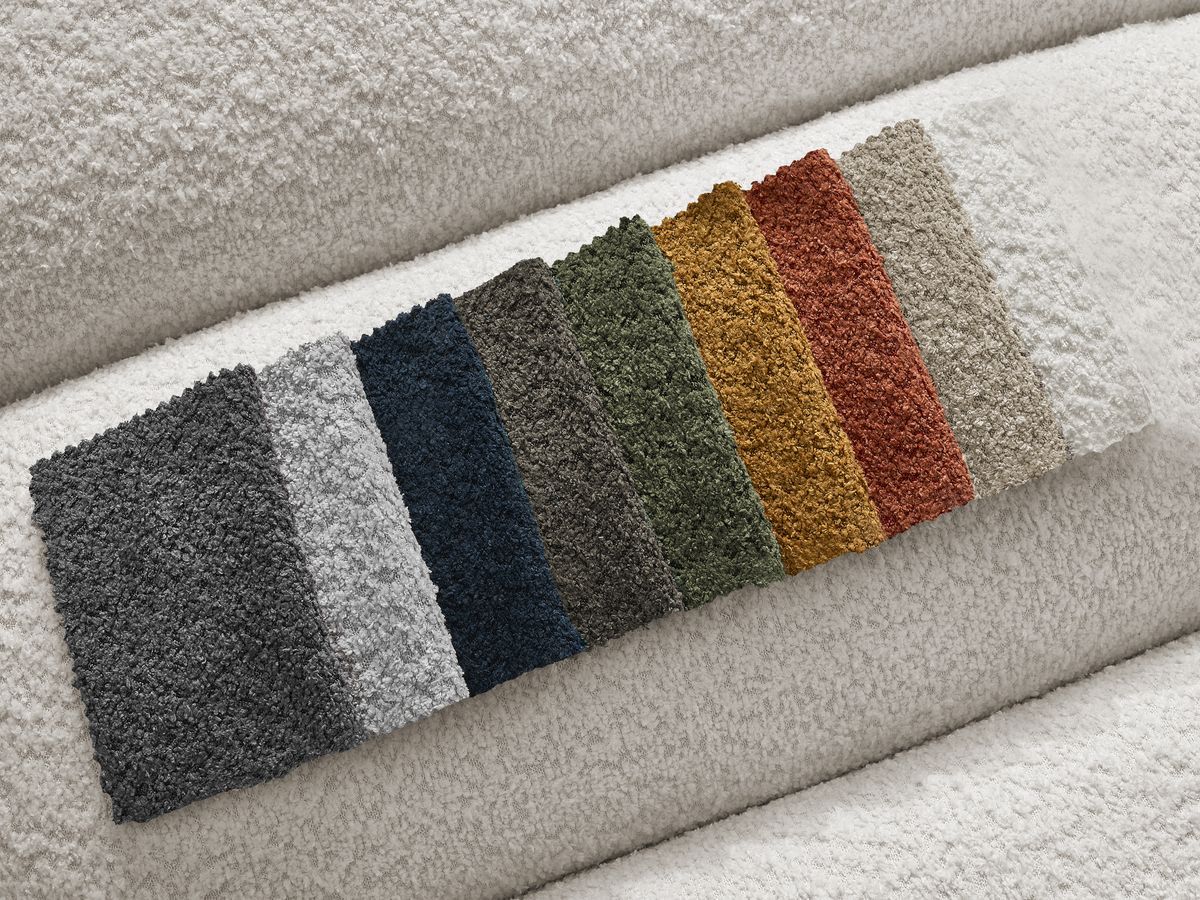 Canapé d'angle fixe modulable ANNECY tissu bouclette avec pouf