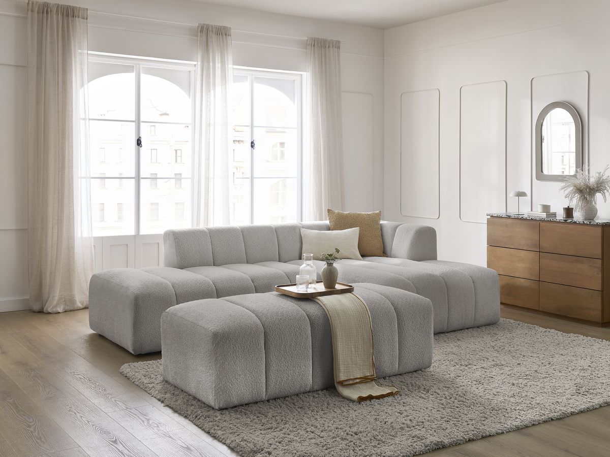 Canapé d'angle fixe modulable ANNECY tissu bouclette avec pouf