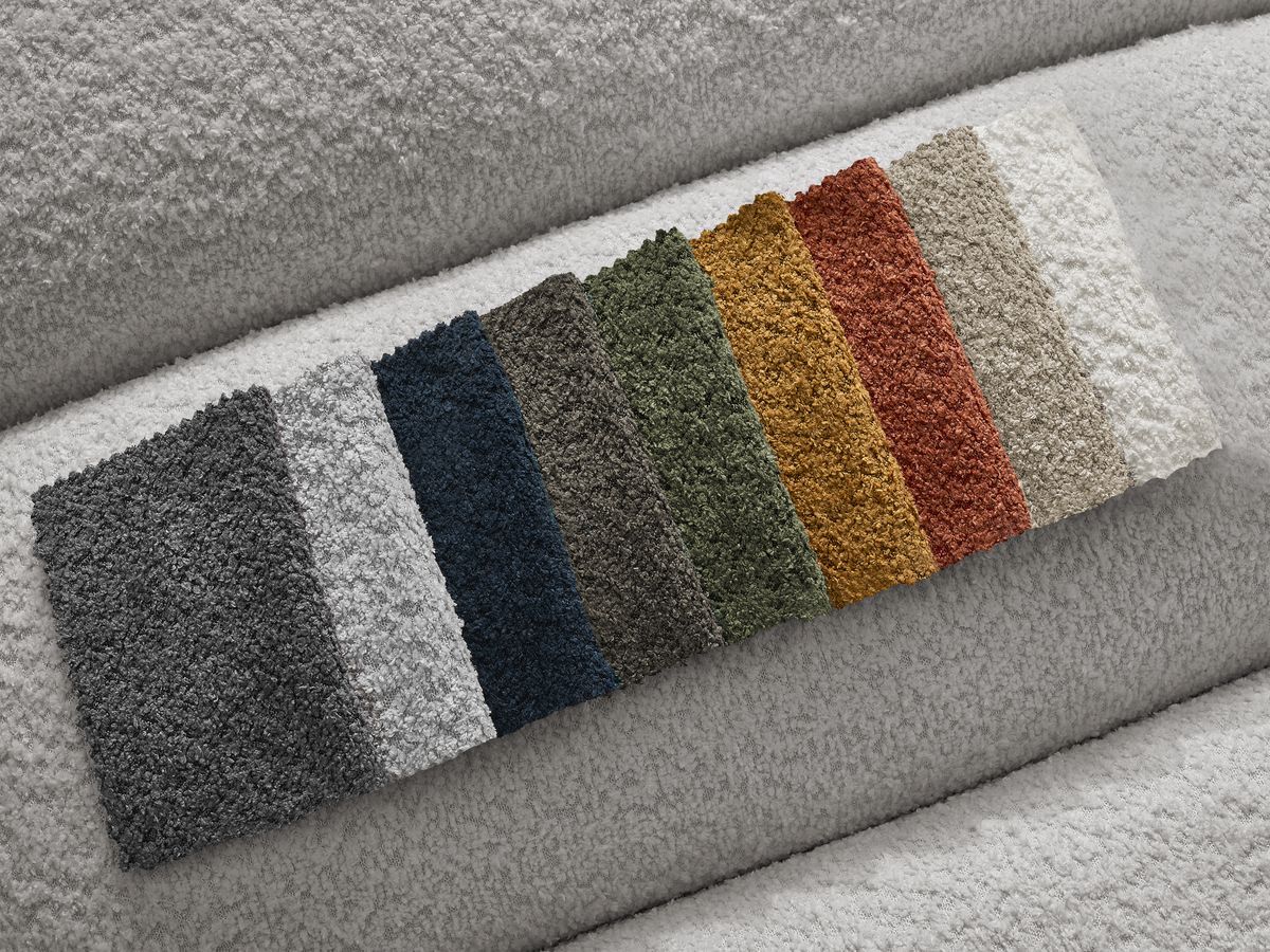 Canapé d'angle fixe modulable ANNECY tissu bouclette avec pouf