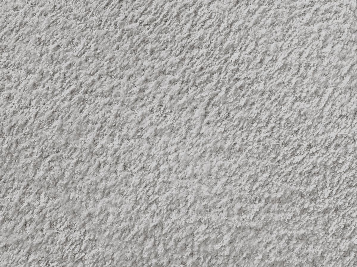 Canapé d'angle fixe modulable ANNECY tissu bouclette avec pouf