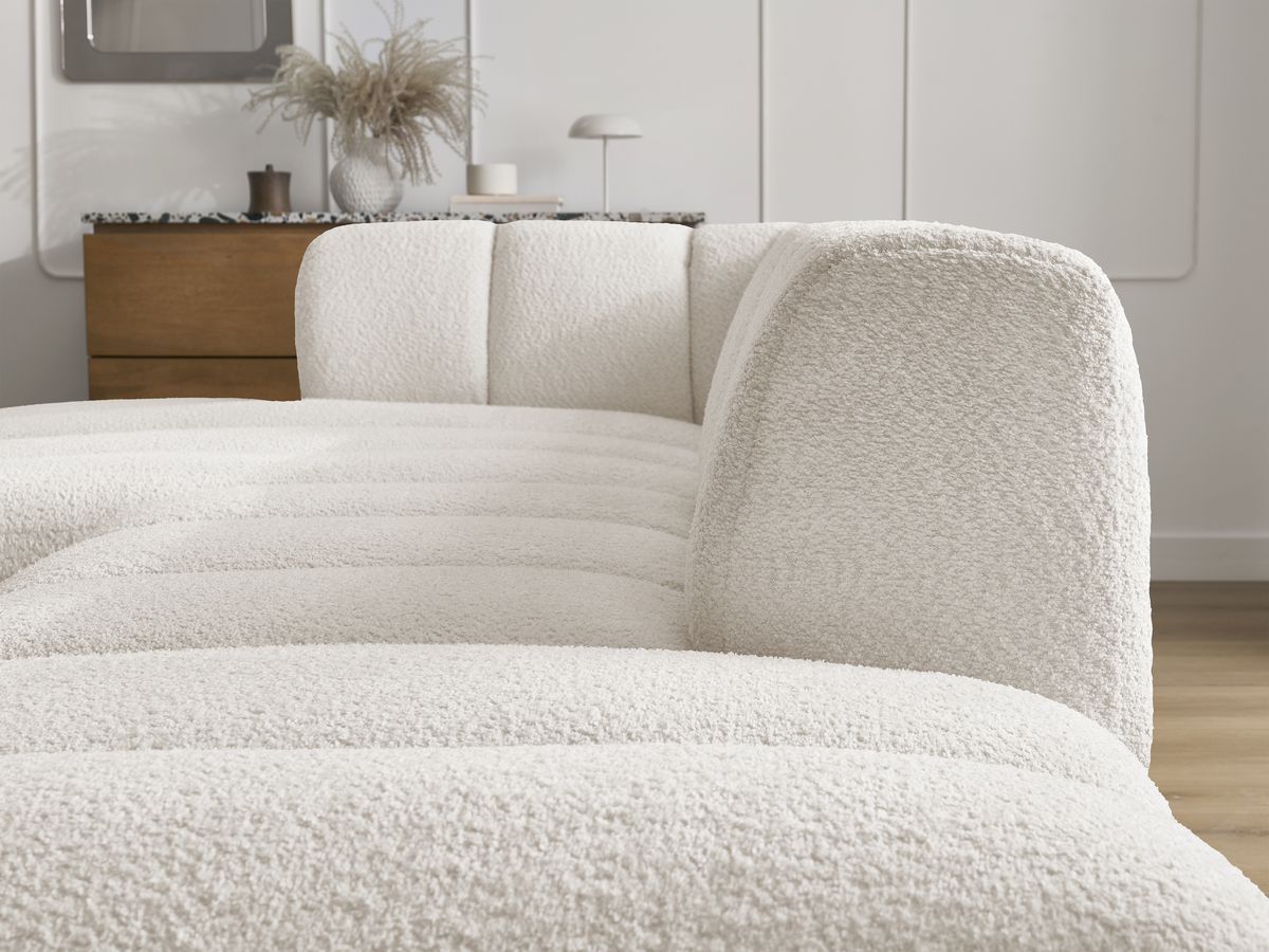Canapé d'angle fixe modulable ANNECY tissu bouclette avec pouf