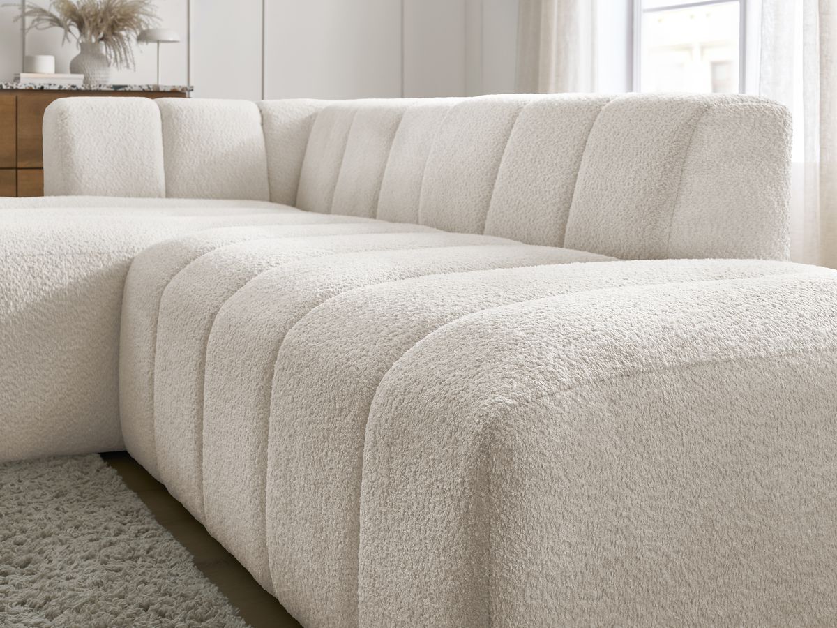 Canapé d'angle fixe modulable ANNECY tissu bouclette avec pouf