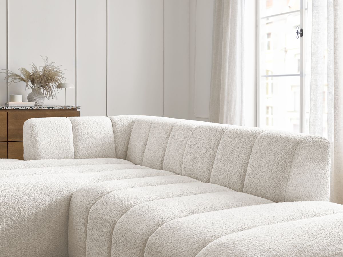 Canapé d'angle fixe modulable ANNECY tissu bouclette avec pouf