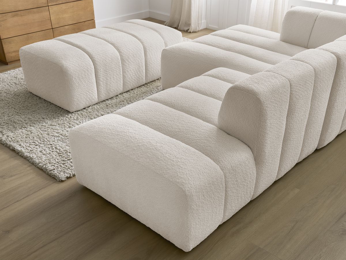 Canapé d'angle fixe modulable ANNECY tissu bouclette avec pouf