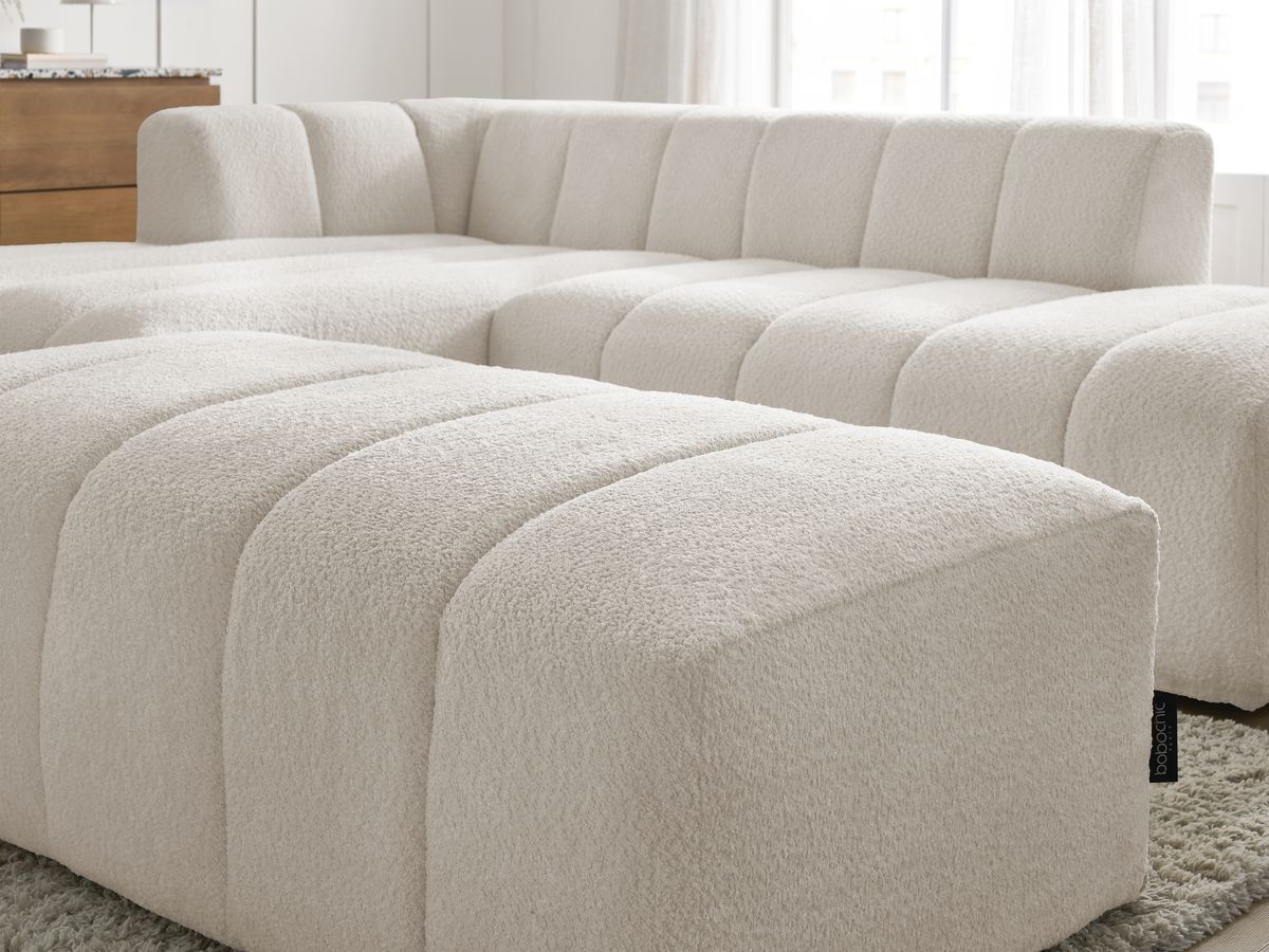 Canapé d'angle fixe modulable ANNECY tissu bouclette avec pouf