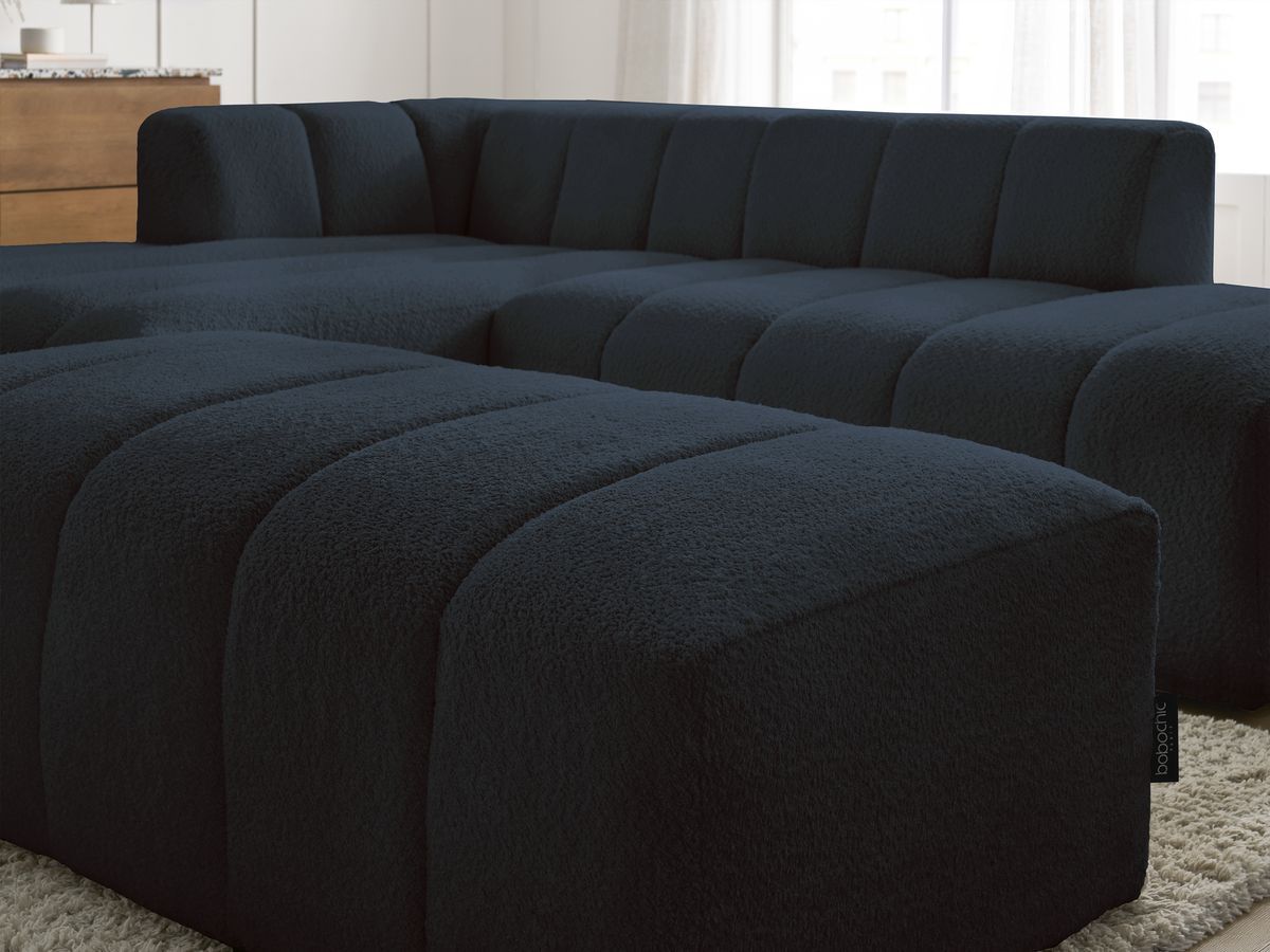Canapé d'angle fixe modulable ANNECY tissu bouclette avec pouf