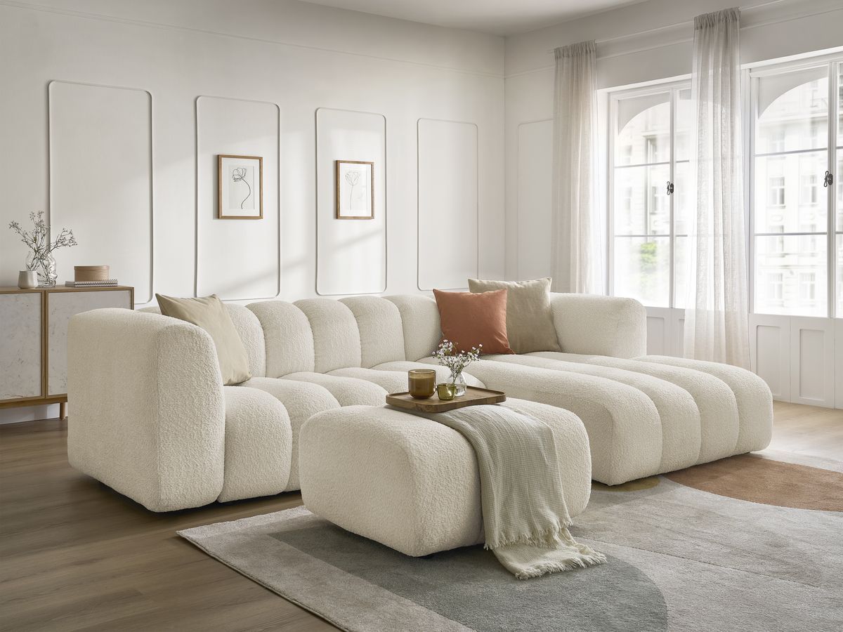 Canapé d'angle fixe TALIA tissu bouclette avec pouf