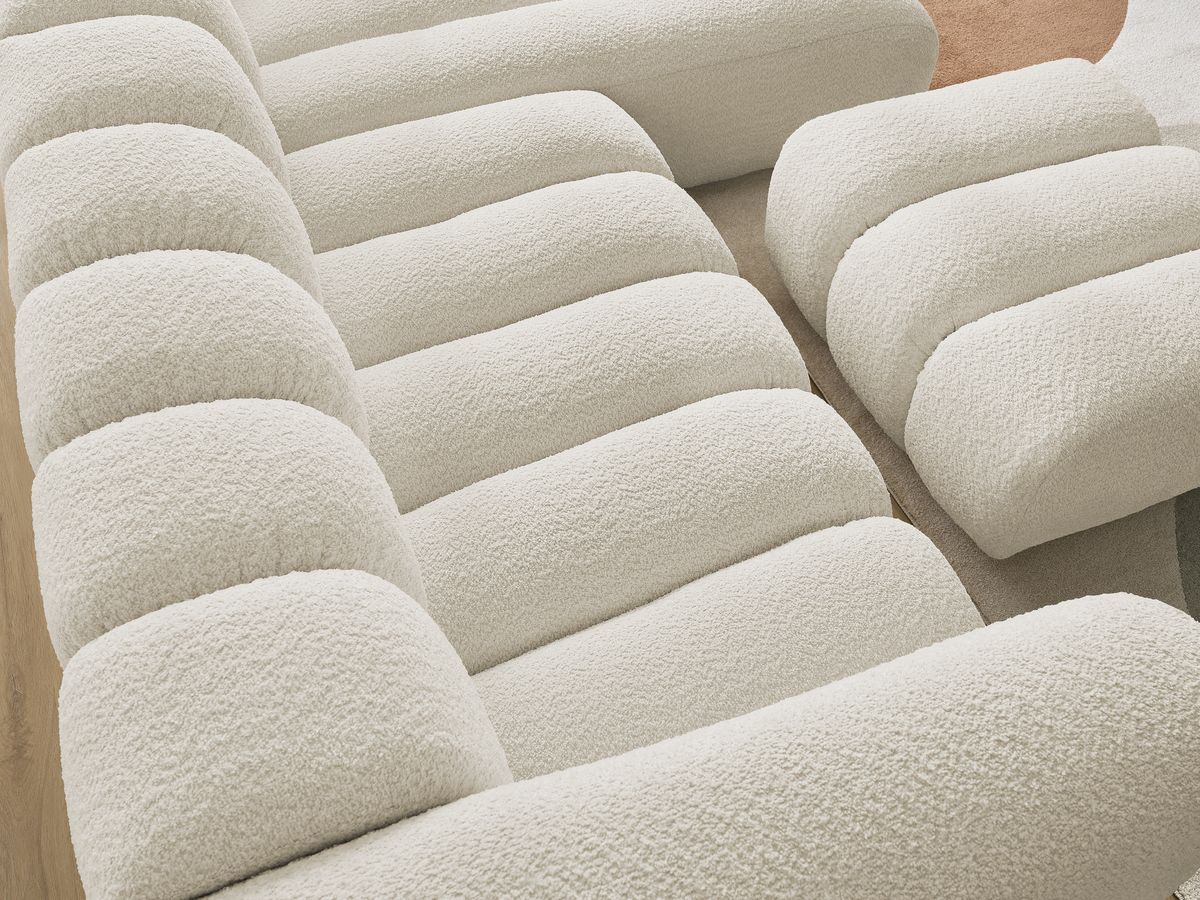 Canapé d'angle fixe TALIA tissu bouclette avec pouf