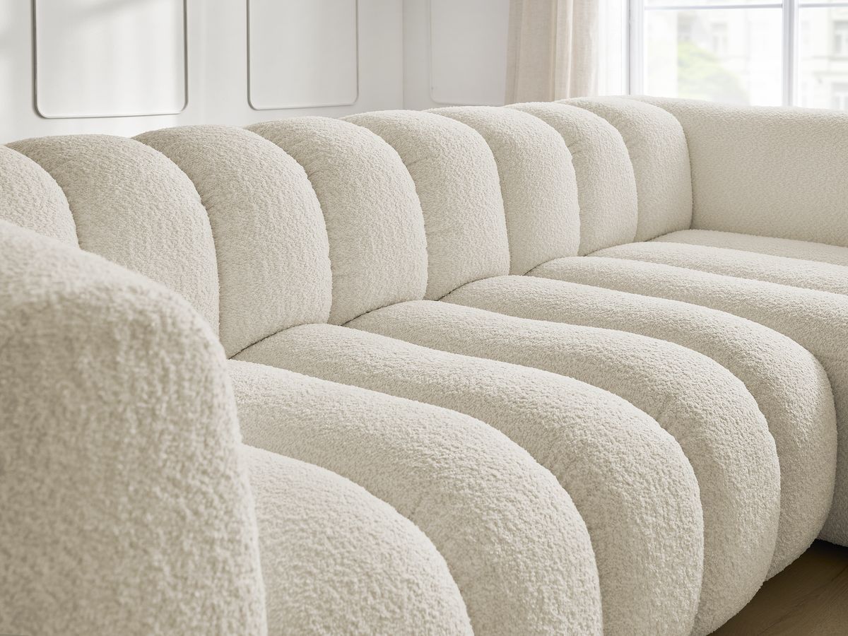 Canapé d'angle fixe TALIA tissu bouclette avec pouf