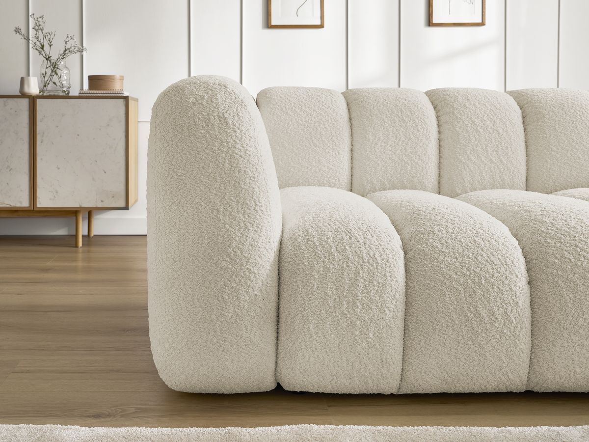 Canapé d'angle fixe TALIA tissu bouclette avec pouf