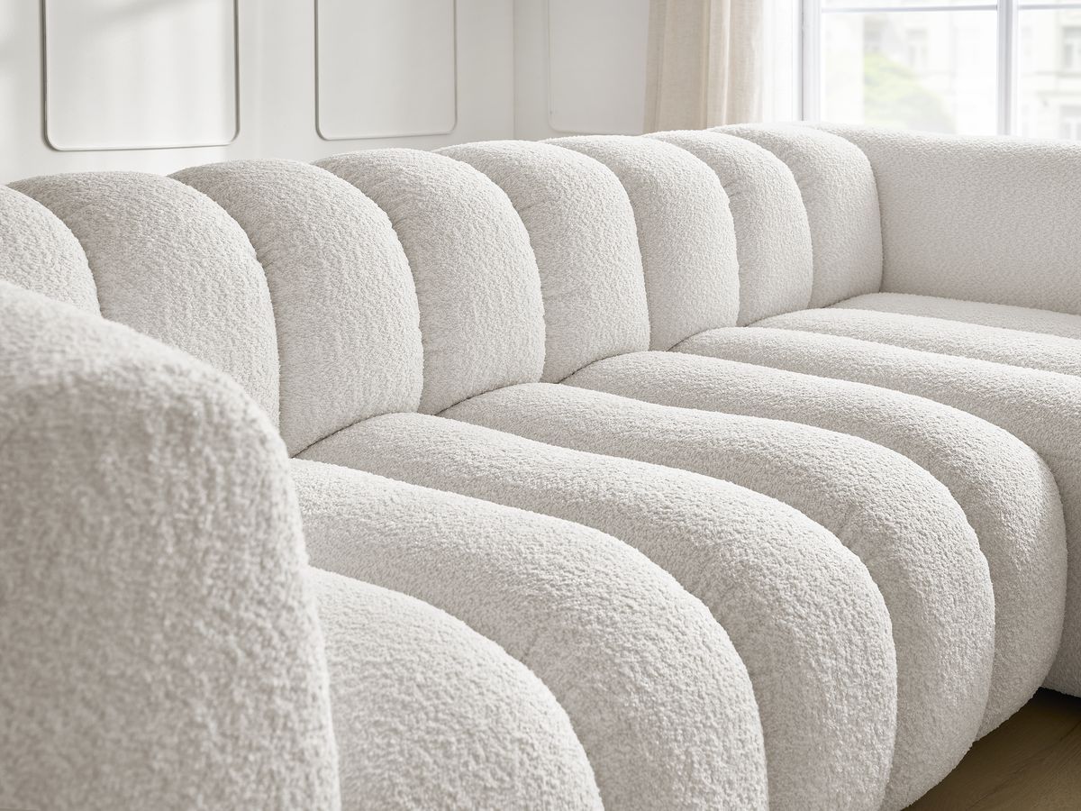 Canapé d'angle fixe TALIA tissu bouclette avec pouf