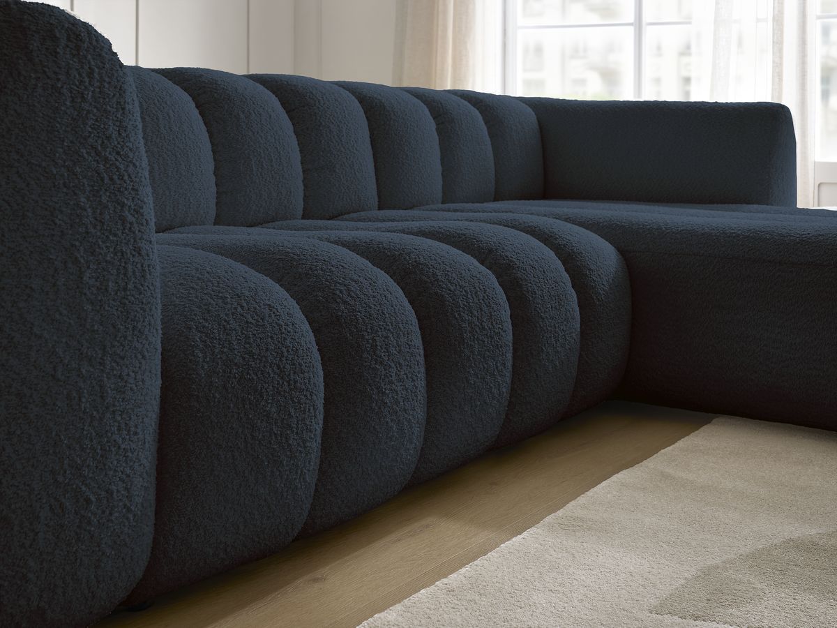Canapé d'angle fixe TALIA tissu bouclette avec pouf