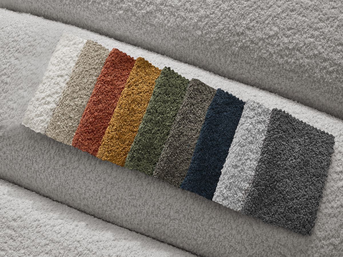 Canapé d'angle fixe TALIA tissu bouclette avec pouf