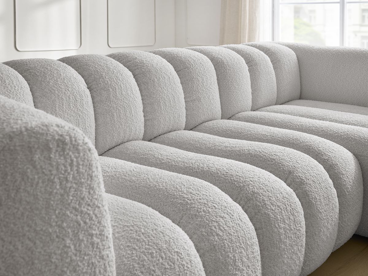 Canapé d'angle fixe TALIA tissu bouclette avec pouf