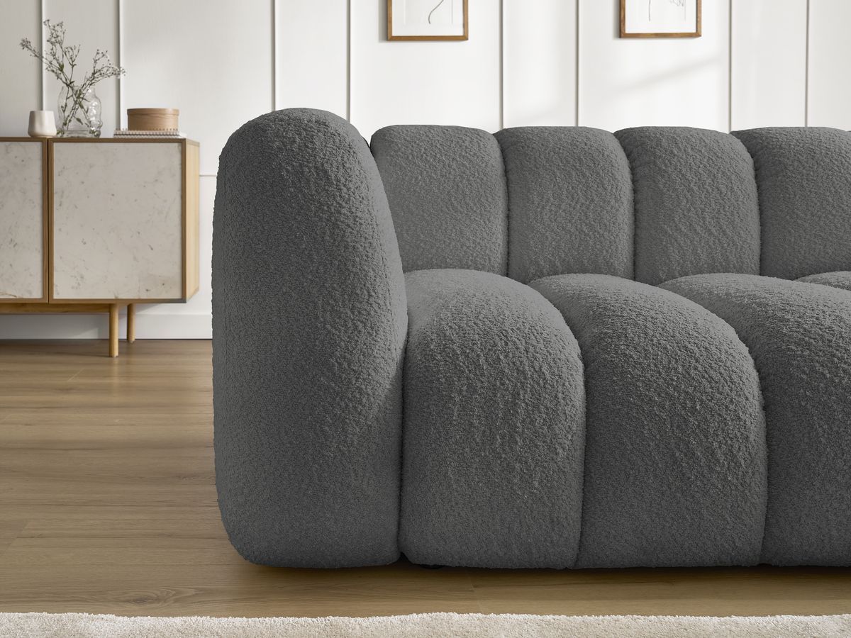 Canapé d'angle fixe TALIA tissu bouclette avec pouf