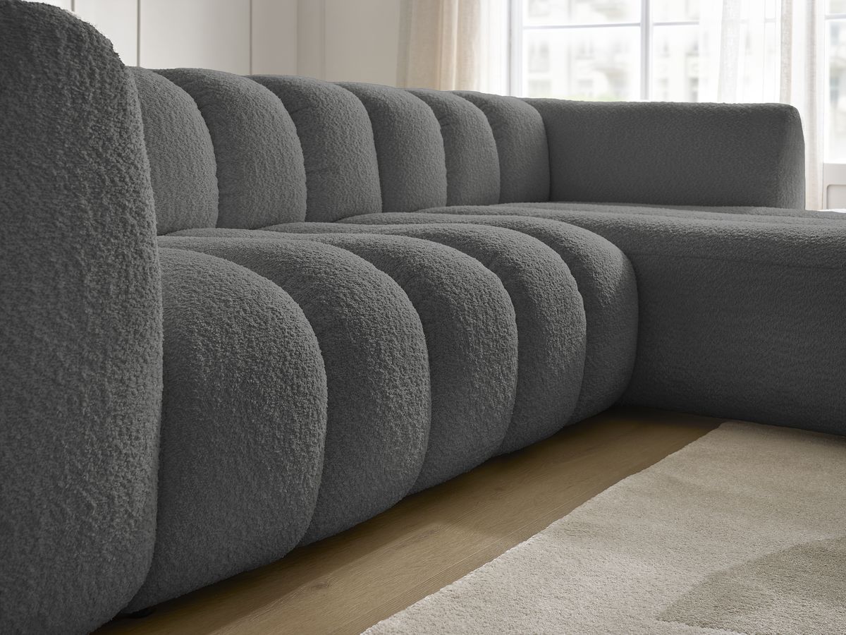 Canapé d'angle fixe TALIA tissu bouclette avec pouf