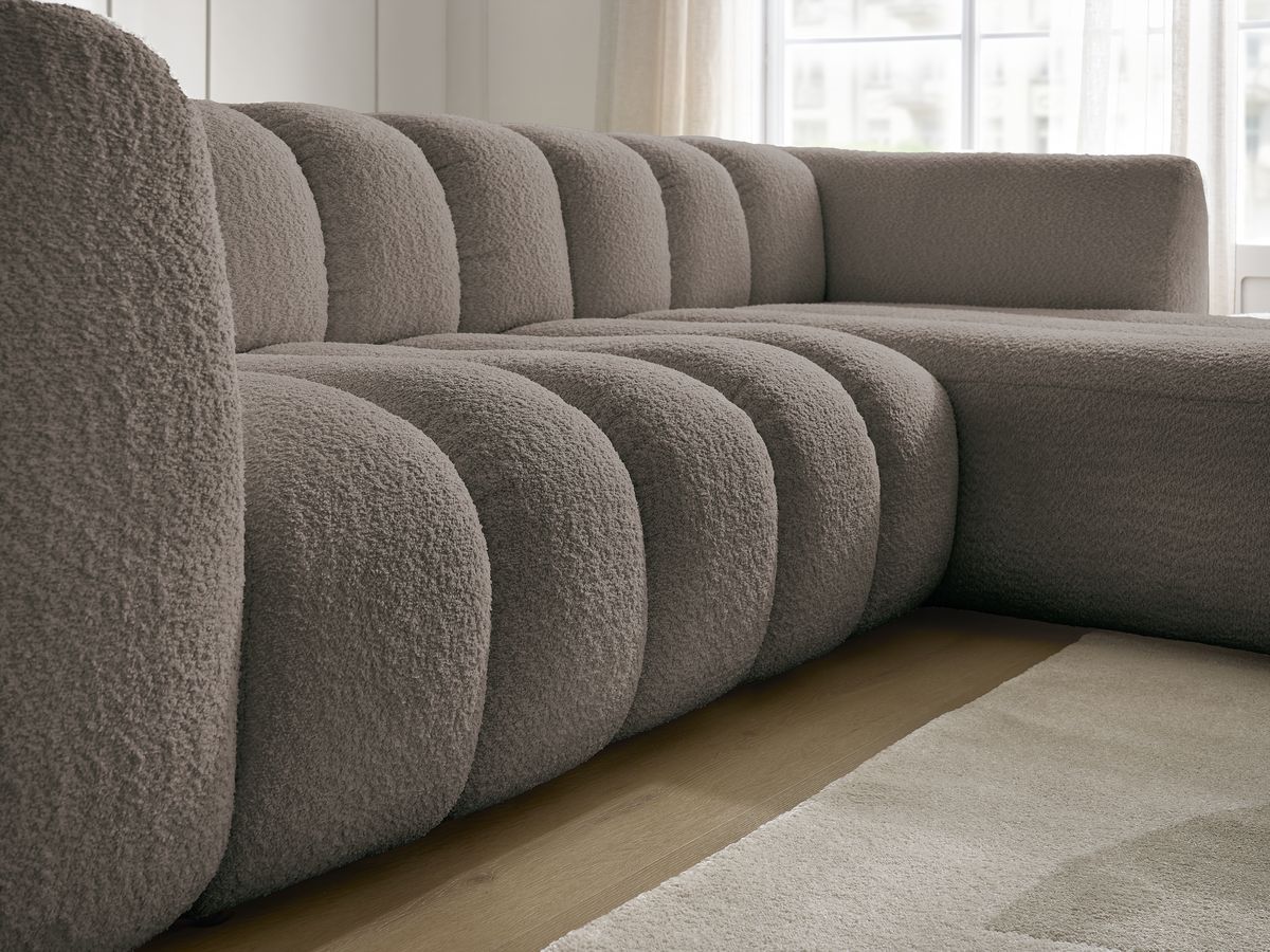 Canapé d'angle fixe TALIA tissu bouclette avec pouf