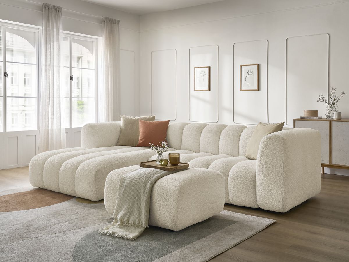 Canapé d'angle fixe TALIA tissu bouclette avec pouf