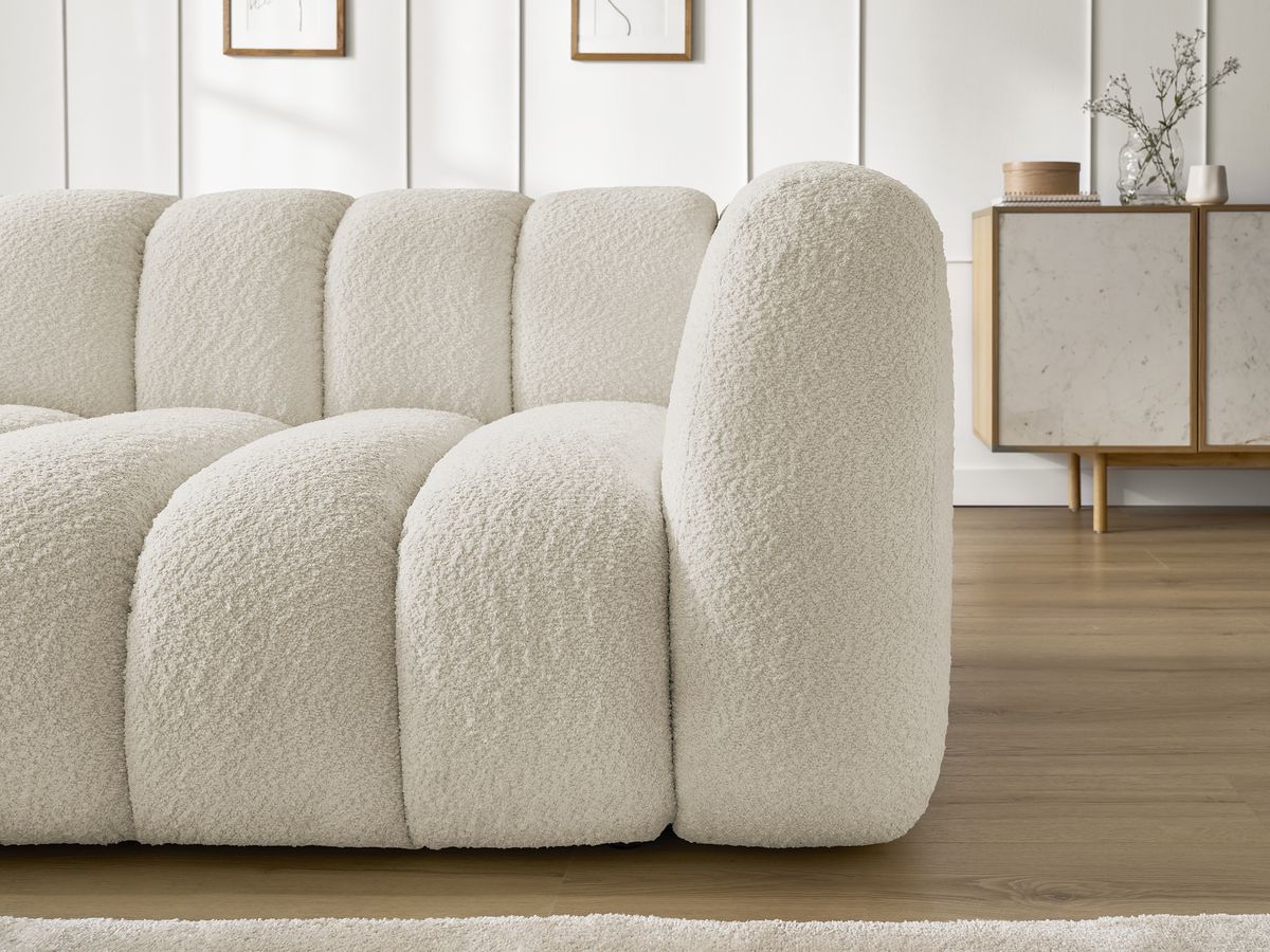 Canapé d'angle fixe TALIA tissu bouclette avec pouf