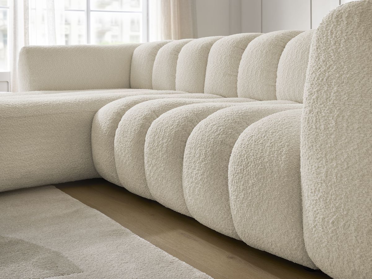 Canapé d'angle fixe TALIA tissu bouclette avec pouf