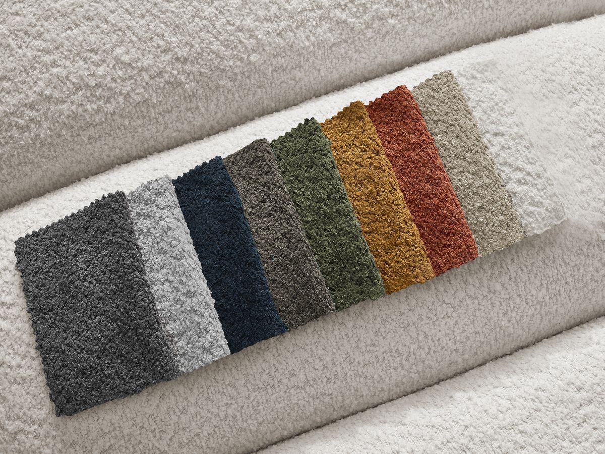 Canapé d'angle fixe TALIA tissu bouclette avec pouf