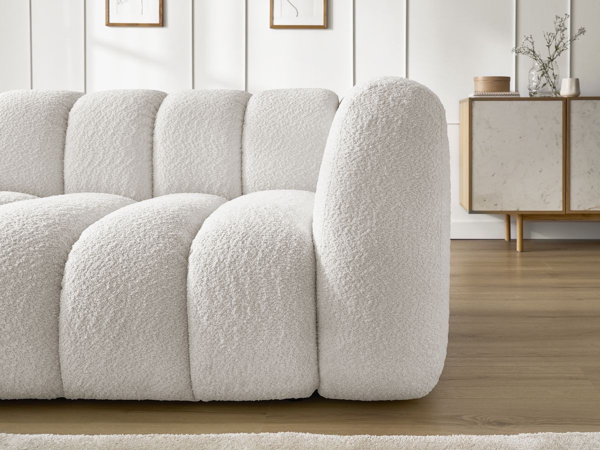 Canapé d'angle fixe TALIA tissu bouclette avec pouf