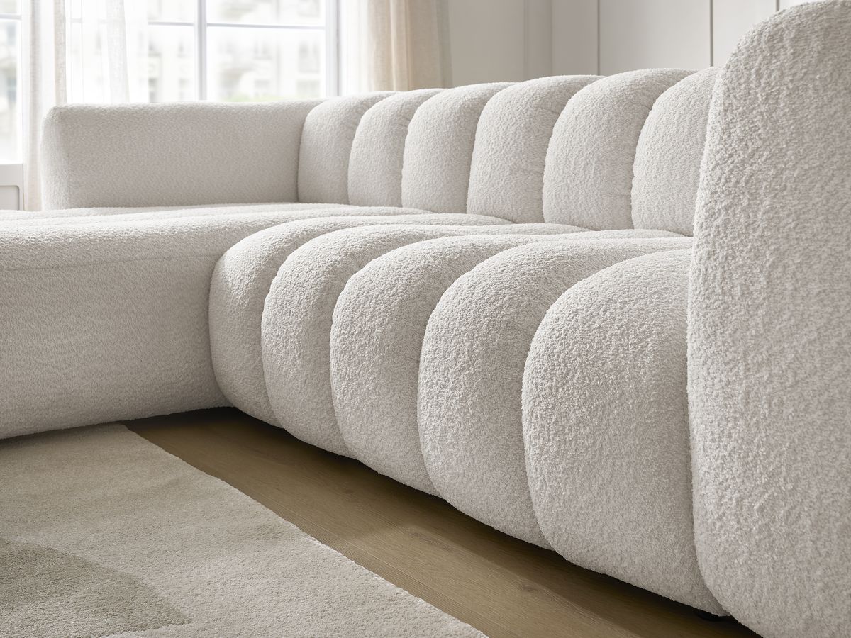 Canapé d'angle fixe TALIA tissu bouclette avec pouf