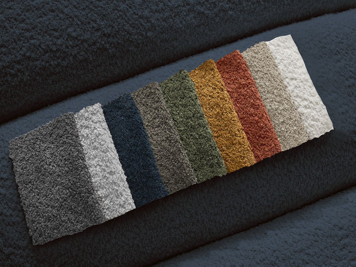 Canapé d'angle fixe TALIA tissu bouclette avec pouf