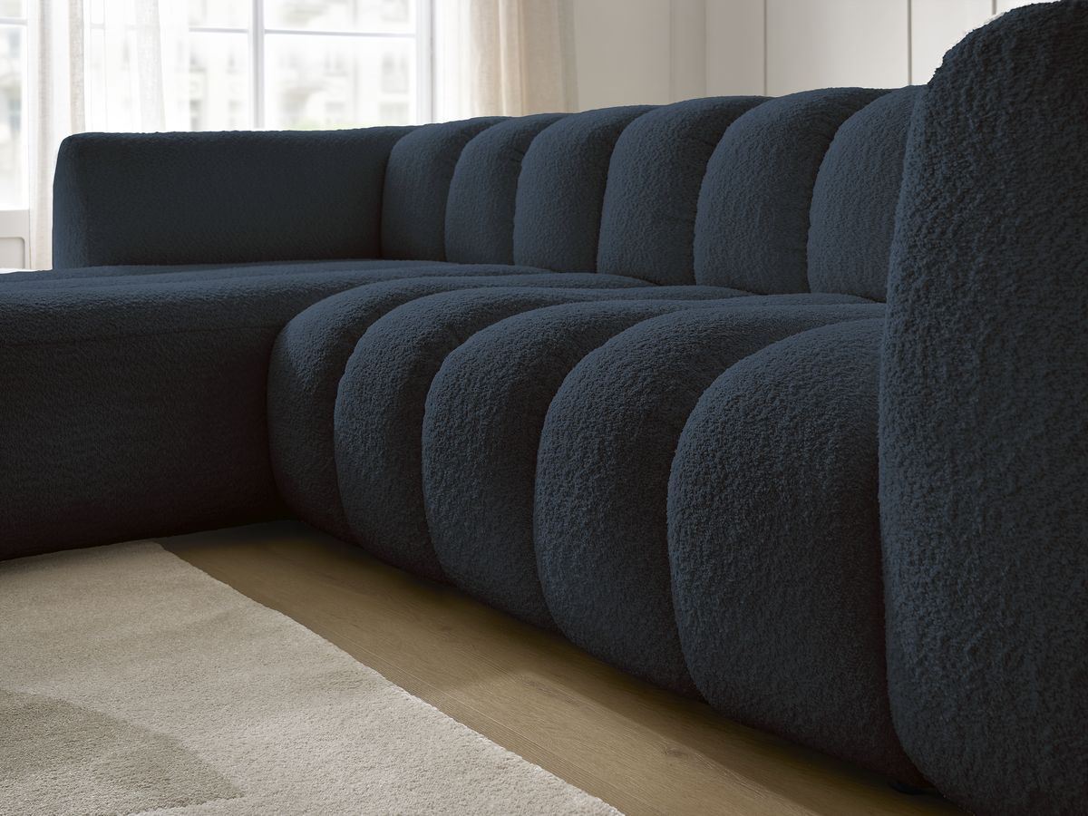Canapé d'angle fixe TALIA tissu bouclette avec pouf