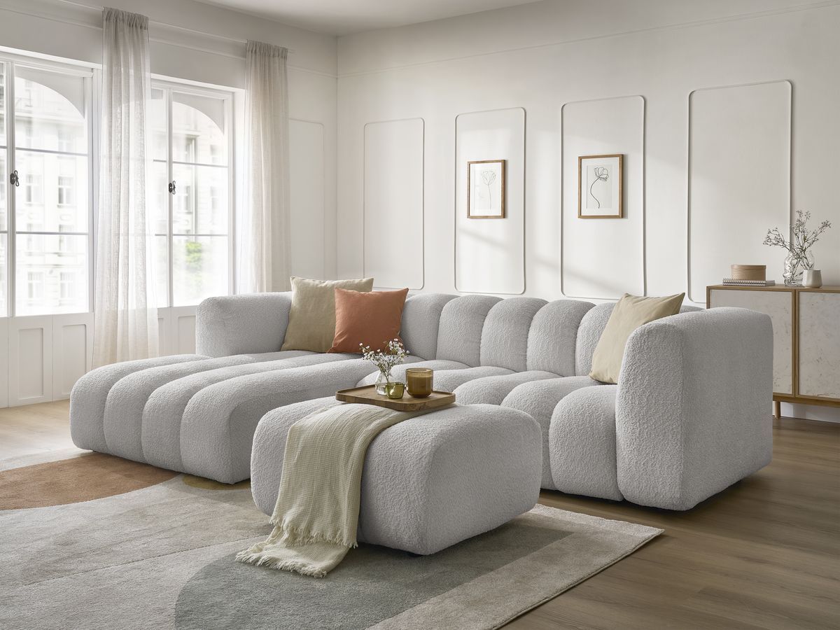 Canapé d'angle fixe TALIA tissu bouclette avec pouf