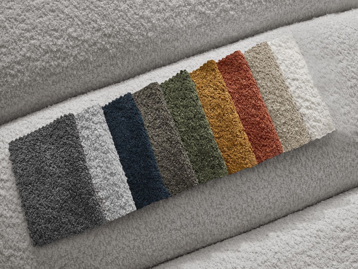 Canapé d'angle fixe TALIA tissu bouclette avec pouf