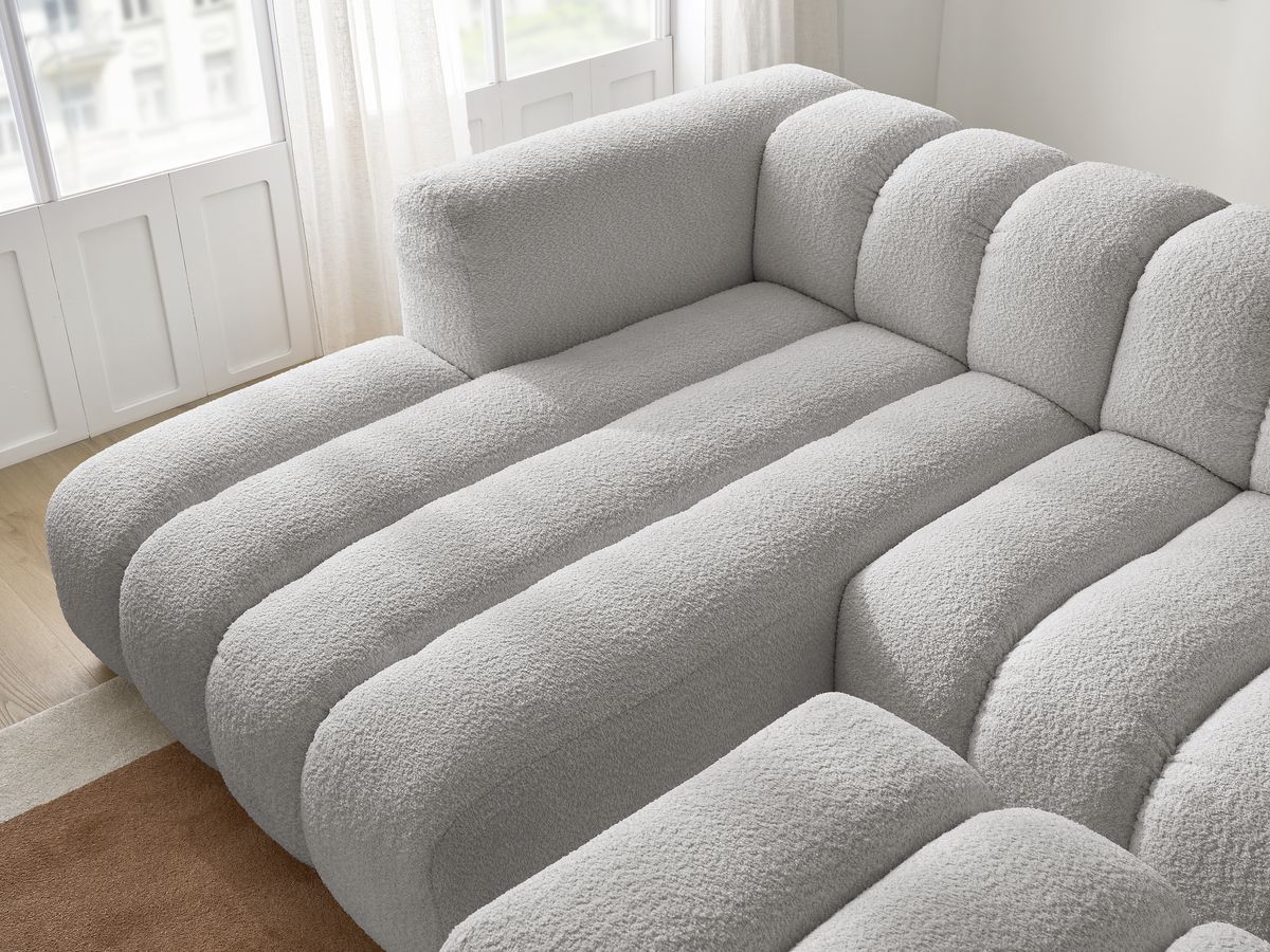 Canapé d'angle fixe TALIA tissu bouclette avec pouf