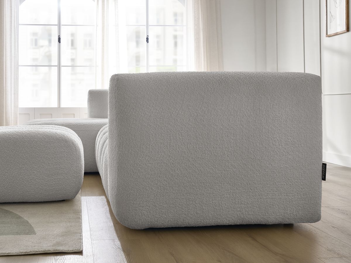 Canapé d'angle fixe TALIA tissu bouclette avec pouf