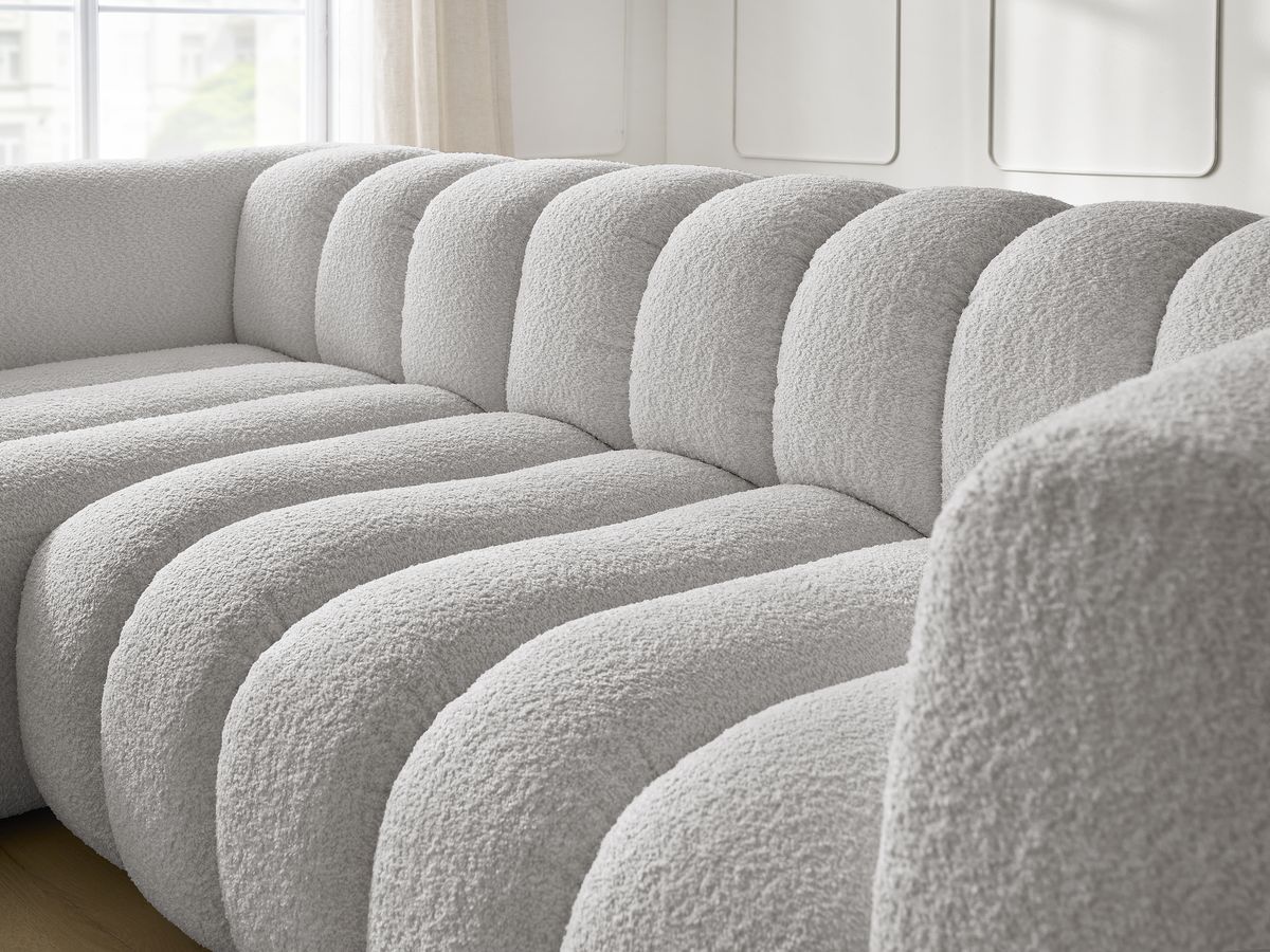 Canapé d'angle fixe TALIA tissu bouclette avec pouf