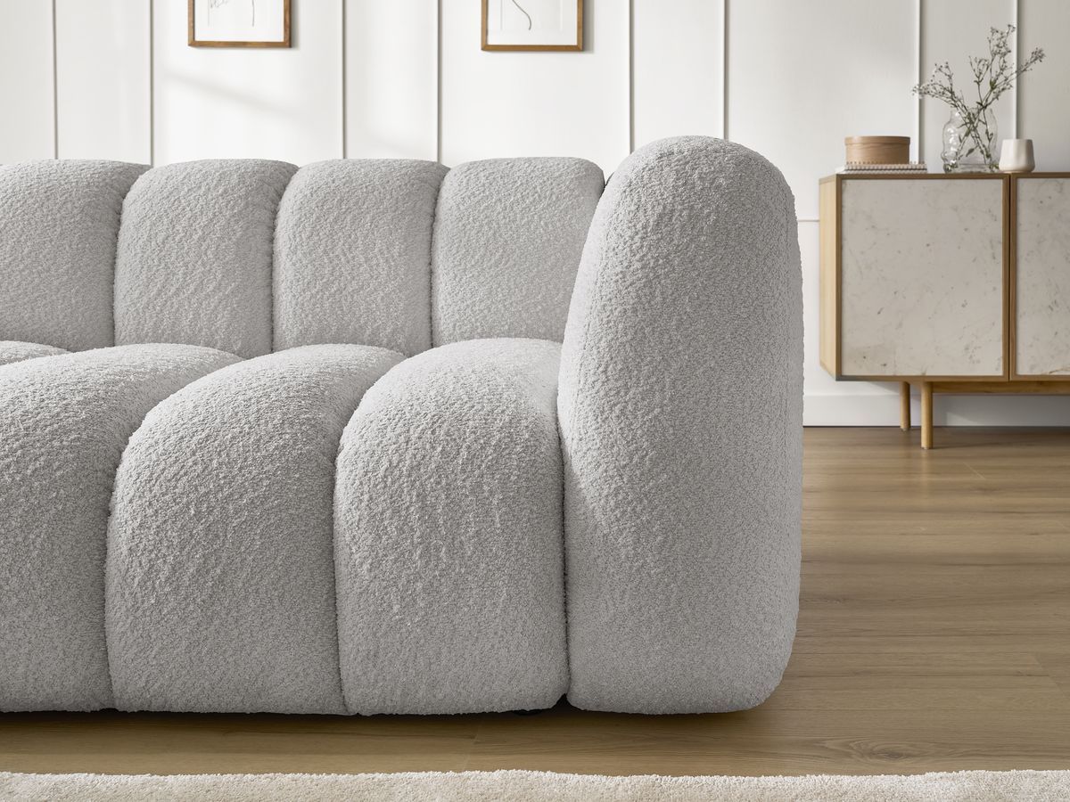 Canapé d'angle fixe TALIA tissu bouclette avec pouf