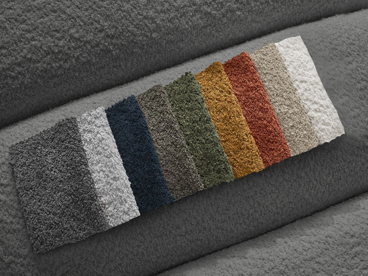 Canapé d'angle fixe TALIA tissu bouclette avec pouf