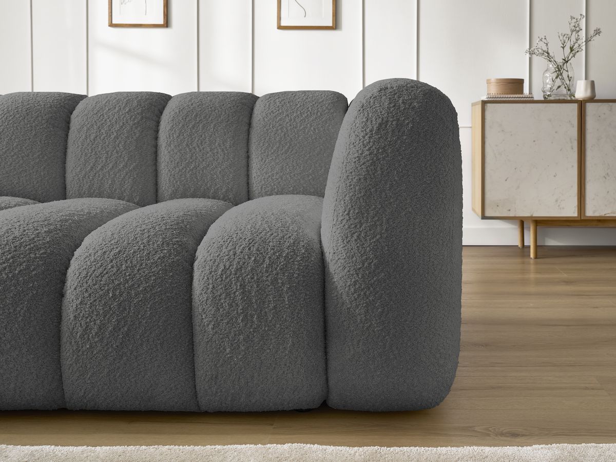 Canapé d'angle fixe TALIA tissu bouclette avec pouf